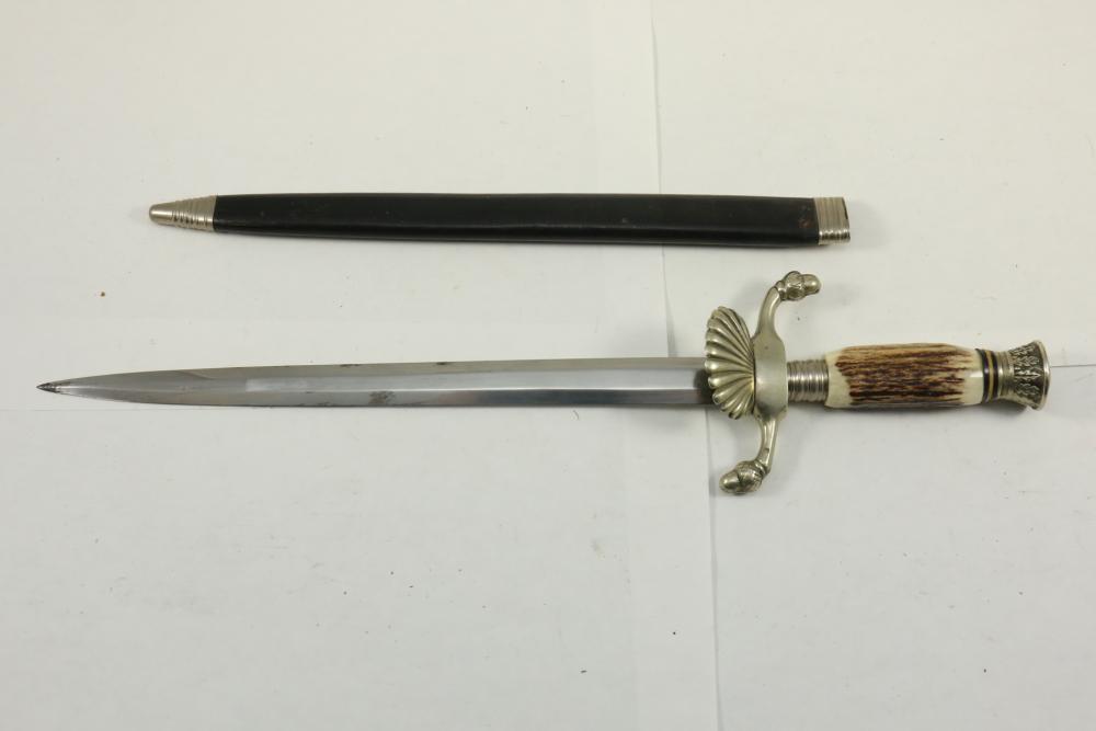 A dagger M 37 for leaders, manufacturer M 7/36, E. & F. Hörster, Solingen  Very good bright blade, the obverse with etched motto Blut und Ehre!  (Blood and Honour!), the reverse etched